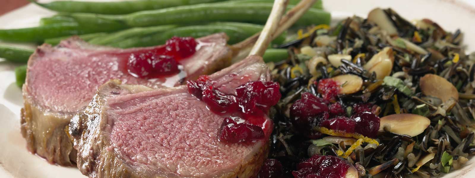 Big Green Egg Cranberry-Marinated Rack of Lamb with Almond Wild Rice