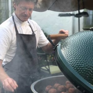 Chef Justin Cogley cooking on the EGG