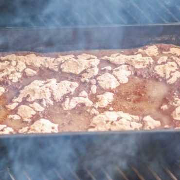 Dump Cake in a square roasting pan prepared on Big Green Egg.