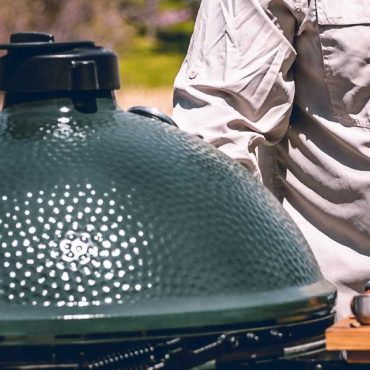 Man preparing to grill on XL Big Green Egg