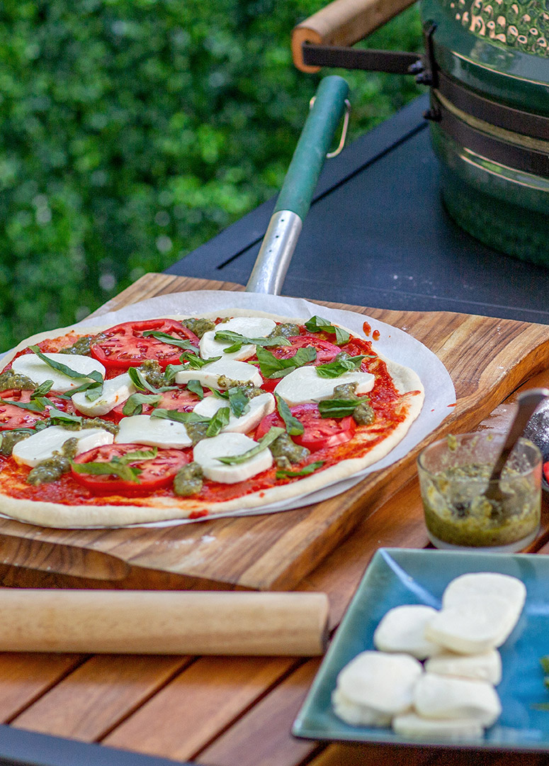 Pizza ready to bake on Big Green Egg