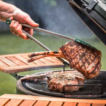 Tomahawk steak with tongs